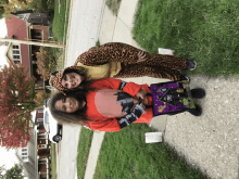 a girl in a leopard print costume holds a witch bag