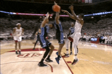 a basketball game is being played on a court that has the letter e on the bottom