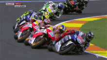 a group of motorcycle racers are racing on a track with the words motogp replay race start