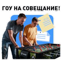 two men are looking at a foosball table with torneo written on it