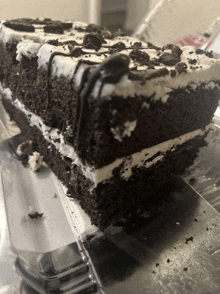 a piece of chocolate cake with oreos on top