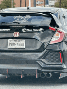 a black honda with a texas license plate pwd 1990