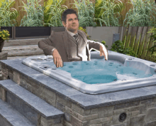 a man in a suit sits in a jacuzzi