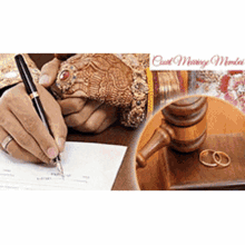 a woman is writing on a piece of paper next to a judge 's gavel and a pair of wedding rings