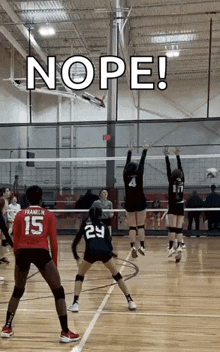 a group of girls are playing volleyball on a court and one of the girls is wearing a jersey with the number 15 on it .