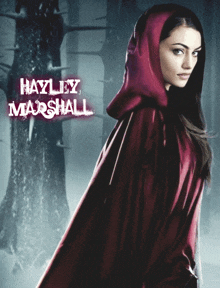 a woman in a red cape with the name hayley marshall