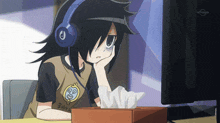 a girl wearing headphones is sitting in front of a computer screen