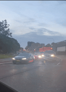 a car with a license plate that says taxi on it is driving down a road