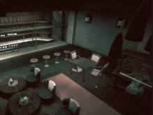 a dark room with tables and chairs and a piano and a bar