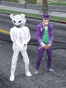 a man in a purple suit stands next to a white cat