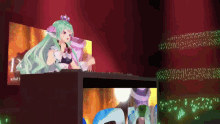 a girl with green hair and a crown on her head is playing a dj set