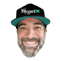 a man with a beard wears a black hat that says blazzard