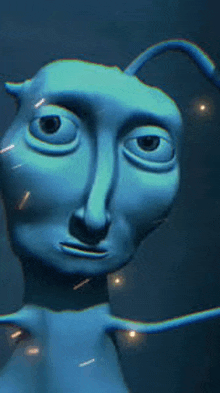 a close up of a blue cartoon character 's face with a strange face .