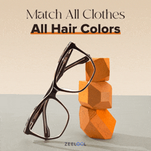 a pair of glasses sitting on top of a stack of wooden blocks with the words match all clothes all hair colors