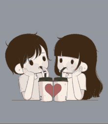 a boy and a girl are drinking from cups with straws that have a heart on them