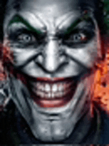 a close up of a joker 's face with a big smile on it .