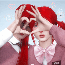 a girl with red hair making a heart with her hands