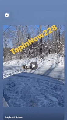 a video of a snowmobile being pulled by a sleigh with tapinnow228 written on the bottom