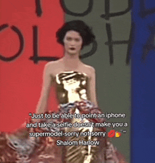 a woman in a gold dress is walking down a runway with a quote by shalom harlow