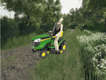 a man sits on a john deere lawn mower