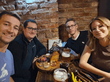 a group of people are sitting around a table with a menu on it