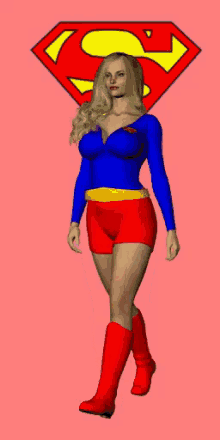 a woman in a supergirl costume is standing in front of a superman symbol