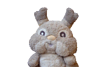 a stuffed animal that looks like a rabbit with antlers on it