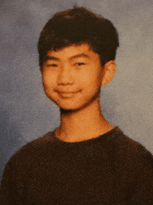 a close up of a young man 's face and neck