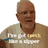 an elderly man with glasses holds a blue toothbrush and says i 've got teeth like a zipper