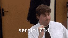 a man in a white shirt and tie with the name sergio 1734 below him