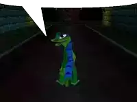 a green lizard with a blue scarf around its neck is in a dark room