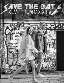 a black and white photo of a bride and groom in front of a wall that says save the date x.viii.mmxxiv