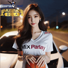 a woman in a mix parlay shirt holds a basketball in front of a car