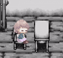 a girl in a wheelchair is sitting next to a white board in a video game .