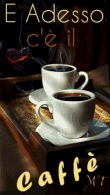 two cups of coffee sit on a tray with the words e adesso c'e il caffe