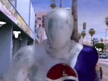 a pixelated image of a pepsi man standing on a city street .