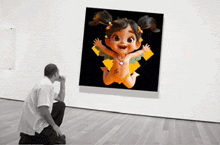 a man is looking at a painting of a little girl