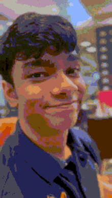 a pixelated image of a man 's face smiling