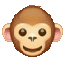 the monkey is smiling and looking at the camera .