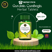 a green bottle of garcinia cambogia herbal tablets on a green background