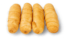 four fried chicken fingers on a white background .