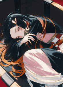 a girl with long black hair and red eyes is laying down