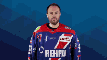 a man wearing a jersey that says rehau on it