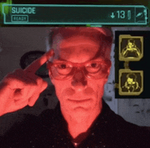 a man wearing glasses is pointing at his head in front of a sign that says " suicide ready "