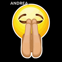 a smiley face with the name andrea written above it