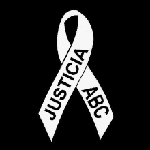 a white ribbon with the words justicia abc on it on a black background .