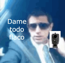 a blurry picture of a man with the words dame todo flaco on the bottom