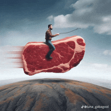 a man is riding on a large piece of meat