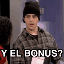 a man wearing a beanie and a plaid shirt is holding a book and says `` y el bonus ? '' .