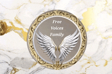 a circle with wings and the words free voices family on it